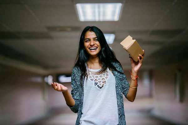 A packaging engineer holding a package..